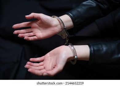 Arrest, Handcuffed Criminal Woman Hands Close Up. Hand Cuffs Locked In Front, Protection From Crime And Law Violation.