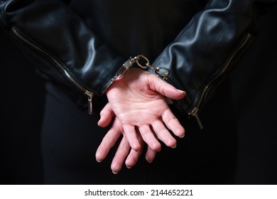 Arrest, Handcuffed Criminal Woman Hands Close Up. Hand Cuffs Locked In Front, Protection From Crime And Law Violation.