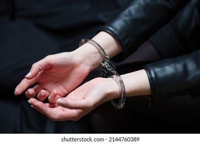 Arrest, Handcuffed Criminal Woman Hands Close Up. Hand Cuffs Locked In Front, Protection From Crime And Law Violation.