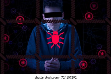 Arrested anonymous computer hacker and cyber criminal with handcuffs wearing hooded jacket hiding face, on network background with worms and virus concept.
