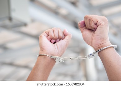 Arrested Man Criminal Gets Locked Up By Handcuff; Crime Scene Investigation With Man Getting Arrested With Handcuff; Concept Of Crime, Public Order, Safety, Law Enforcement; Old Asian Man Model