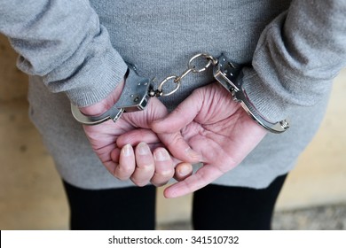 Arrested Woman In Handcuffs Behind Her Back