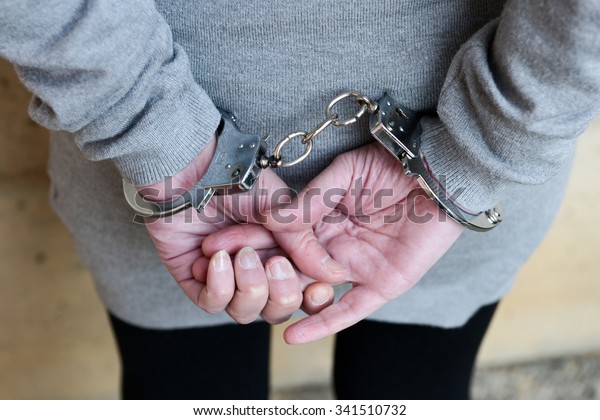 Arrested Woman Handcuffs Behind Her Back Stock Photo (Edit Now) 341510732