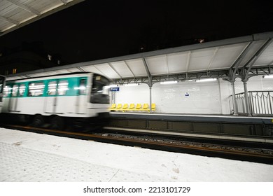 Arrival Of A Parisian Subway In A Parisian Metro (metropolitain) Station (Passy, Line 6) In Paris, France.