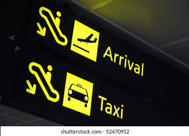 Arrival and taxi signages at the airport for concepts related to travel and transportation, aviation and airport, and vacation.