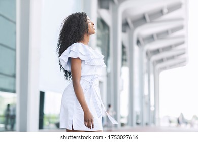 Arriving To Homeland. Side View Portrait Of Pleased Black Woman Standing Outside Of Airport After Arrival And Breathing Air