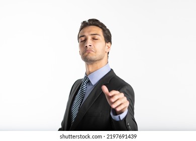 Arrogant Businessman Demonstrating Irritation And Haughtiness With Hand Gesture And Face Expression Isolated On White Background