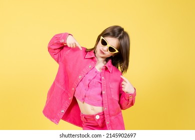 Arrogant Little Girl Pointing Herself Isolated On Yellow Background. Egocentric Child Concept