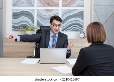 Arrogant Male Boss In Black Suit Firing His Female Worker And Pointing On The Door. Dismissal And Fired Colleague Concept