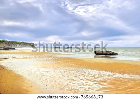 Arromanches les Bains, seafront beach and remains of the artificial harbour, used on D-Day in World War II. Normandy, France.