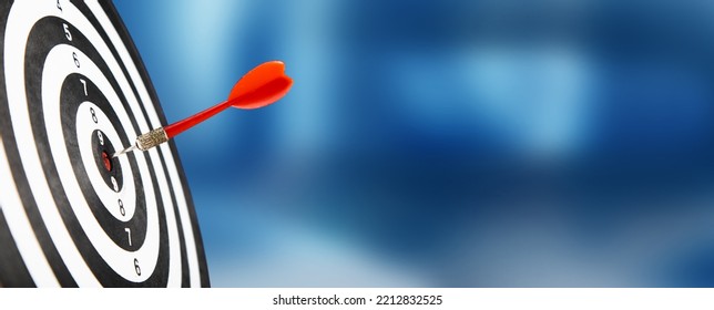 Arrow in the center of the dartboard. The concept of hitting the target - Shutterstock ID 2212832525
