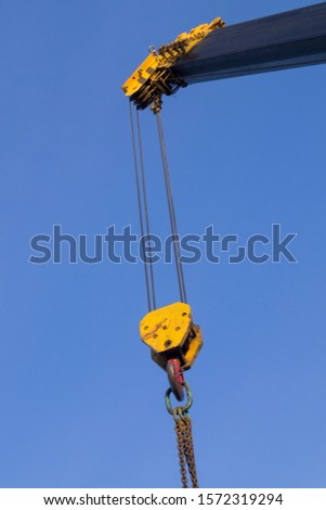 arrow of a construction crane against the sky