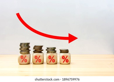 Arrow down red percentage stack of coins.
Symbolizing the fall of the economy financial concept.
Copy space for text.