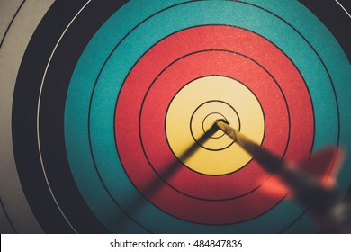 Arrow hit goal ring in archery target vintage style