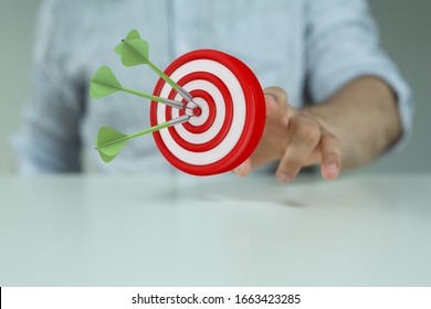 arrow hitting in the target center of dartboard on bullseye - Shutterstock ID 1663423285
