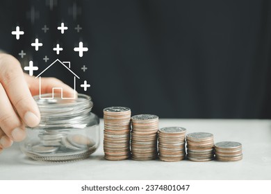 Arrow up and home icon with step stack of coin like a graph. Concepts of home interest, real estate, investing in inflation home loan interest rate hike.