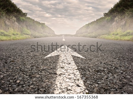 arrow on asphalt road to the horizon