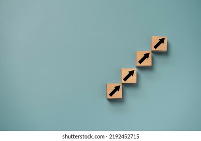 Up arrow which print screen on wooden cube block for business investment ,financial interest  increasing rate and career path growth concept. - Shutterstock ID 2192452715
