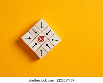 Arrows on wooden blocks points the target symbol. Goal achievement, goal setting, success and planning to reach the target objectives in business concept. - Shutterstock ID 2228557487
