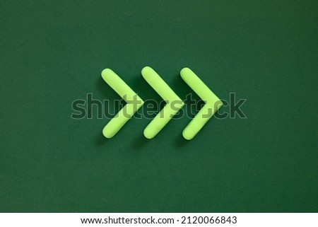Arrows pointing right side. 3D mockup, pointer sign pointing direction on green background. Right way concept.