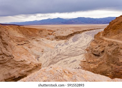 Arroyo Ephemeral Stream Channel Rocky Flow Into Badwater Basin Of Death Valley Desolate Desert Landscape, Death Valley National Park, California, CA, USA