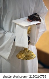 Ars-sur-Fromans. Sanctuary-Shrine of Jean-Marie Vianney (the Cure d'Ars). Altar server with a chalice.  France.