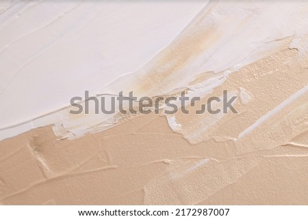 Art Acrylic smear blot brushstroke painting wall. Abstract texture beige, white color stain horizontal copy space canvas background.