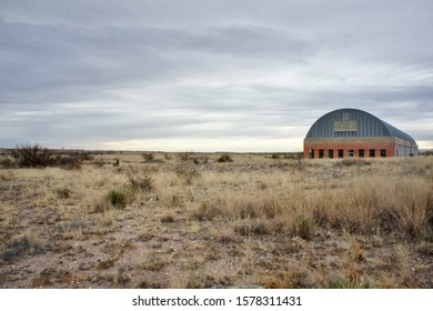 Art barn in grassy field on cloudy day near Marfa Texas 