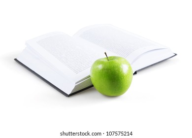 art book and ripe green apple - Powered by Shutterstock