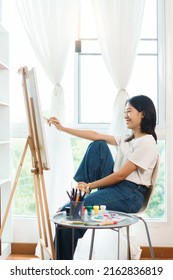 The Art Concept, Asian Female Artist Using Paint Brush To Painting For Create Artwork On Canvas.