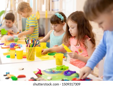 Art and craft activity in kindergarten. Preschool kids hands working in day care center. Group of children engaged in handcrafts - Shutterstock ID 1509317309