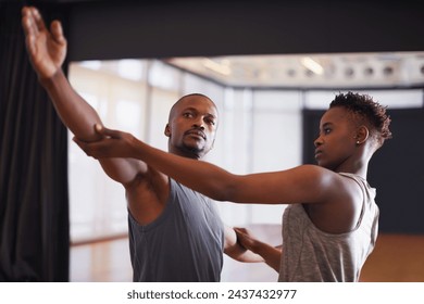 Art, creative or dance with student and teacher in class together for theater performance training. Fitness, learning and school with black man instructor teaching dancer in studio for production - Powered by Shutterstock