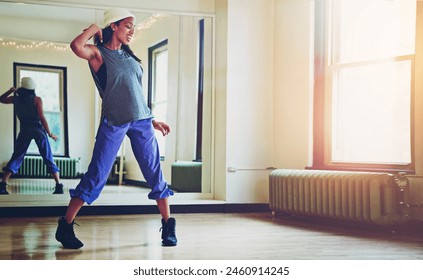 Art, dance and studio with hip hop black woman at mirror for practice, recital or rehearsal. Creative, energy and fitness with happy dancer in class for expression, performance or dancing workshop - Powered by Shutterstock