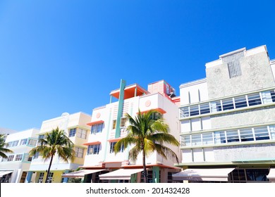 Art Deco Architecture Of Miami Beach, Florida. Street With Palms And Colorful Buildings.