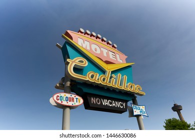 Art Deco Sign for the Cadillac Hotel, advertising color television and air conditioning. Skylon Tower in the background.  Niagara Falls, Ontario, Canada July 8, 2019.                     