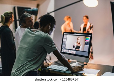 Art Director Checking The Photos On A Monitor