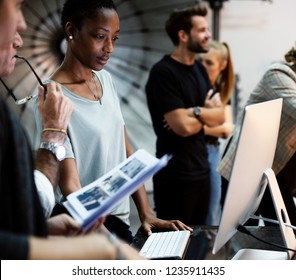 Art Director Checking The Photos On A Monitor