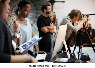 Art Director Checking The Photos On A Monitor