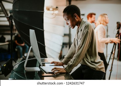 Art Director Checking The Photos On A Monitor