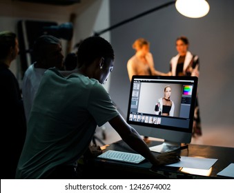 Art Director Checking The Photos On A Monitor