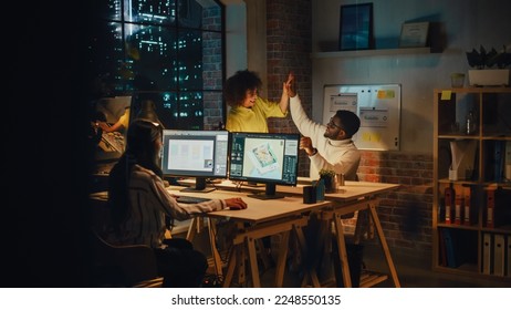 Art Director and Graphic Designer Discussing a Marketing Campaign for Business Partner. Successful Female and Male Colleagues High Five Each Other. Small Creative Team Working in the Office Together. - Powered by Shutterstock