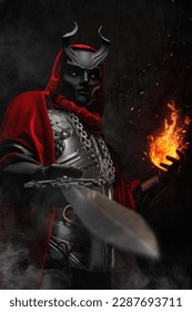 Art of esoteric wizard dressed in silver cuirass and red robe casting fireball.