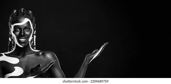 The Art Face. Black And White Body Paint On African Woman. Abstract Creative Portrait. Bright Fashion Makeup On The Girl.