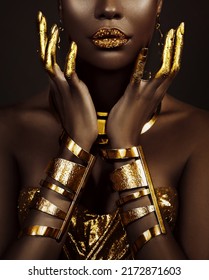 art fantasy portrait african american woman. female hands close-up, fingers in golden paint. Girl queen Cleopatra style. greek gold bracelets. Creative metallic professional makeup lips diamonds gloss - Shutterstock ID 2172871603