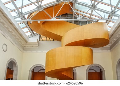Art Gallery of Ontario, Toronto, Ontario, Canada - September15, 2012: The new sculptural round staircase designed by Frank Gehry integrates well in the courtyard of the existing baroque building.