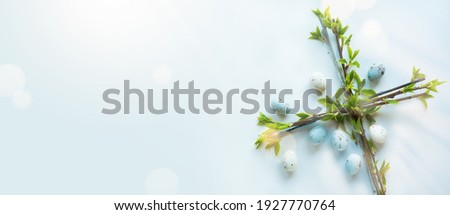 Art Happy Easter Holiday banner or greeting card background with Easter flower cross and Easter eggs on blue background; Christian awakening life symbol