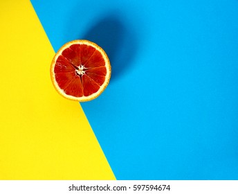 Art Nouveau Style Concept Image, Blood Orange On Yellow And Blue / Multi Colored Trendy Background, Food And Healthy Concept  