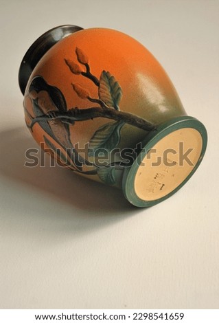 Art nouveau vase with decorative bird.