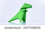 Art of Origami : Green Tyrannosaurus, isolated On White Background