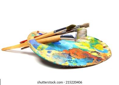 Art Palette With Paint And A Brush On White Background 